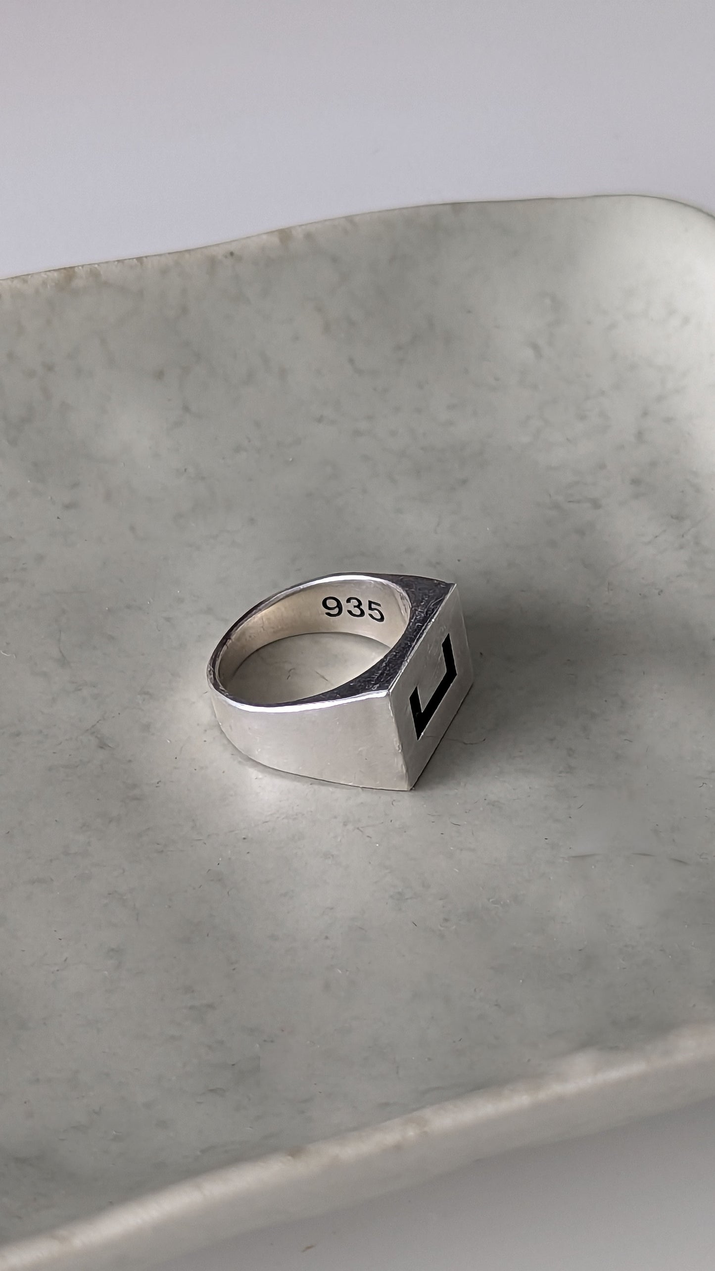 Side shot of product showcasing the Oxidized 935 detail on the inside of the ring